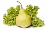 Green Pear With Lettuce On White Stock Photo