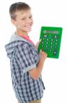 Young Boy Using Calculator Stock Photo