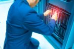 Man Fix Server Network In Data Center Room Stock Photo