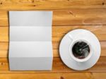 White Folded Paper And White Coffee Cup Stock Photo