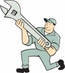 Mechanic Kneeling Holding Spanner Wrench Cartoon Stock Photo