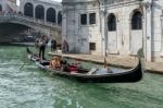 Gondoliers Ferrying People In Venice Stock Photo