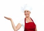 Smiling Senior Chef Showing Gesture Stock Photo