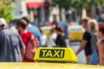 Yellow Taxi Sign On Cab Vehicle Roof Stock Photo