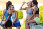 Group Of Young Women Doing Stretching In The Park Stock Photo