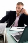 Businessman Busy On Phone Stock Photo