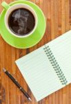 Tea Cup And Blank NoteBook Stock Photo