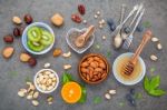 Ingredients For A Healthy Foods Background, Nuts, Honey, Berries Stock Photo