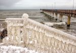 Ice Covered Staircase On The Beach Stock Photo