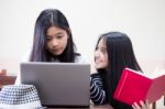 Two Asia Thai High School Student Uniform Best Friends Beautiful Girl Using Her Laptop Stock Photo