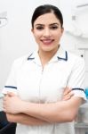 Smiling Dentist Posing Confidently Stock Photo