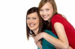 Mother Giving Daughter Ride On Back Stock Photo