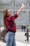 Young Brunette With A Smart Phone Stock Photo