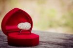 Love Ring In Red Velvet Stock Photo