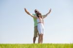 Couple Stretching Their Hands Together Stock Photo