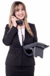 Businesswoman Receiving Exciting News Over The Phone Stock Photo