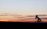 Oil Well At Sunset Stock Photo