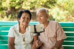 Happy Senior Couple Posing For A Selfie Stock Photo