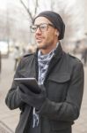 Man Holdin I-pad Tablet Computer On Street Stock Photo