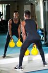 Young Muscular Man Working Out With Kettlebell Stock Photo