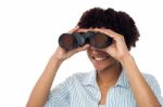 Woman Watching Through Binoculars Stock Photo