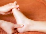 Reflexology Foot Massaging Stock Photo