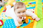 Infant Boy On Playmat Stock Photo