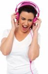 Lady Enjoying Music Stock Photo