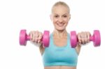 Woman Exercising With Dumbbells Stock Photo