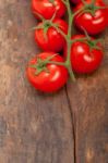 Fresh Cherry Tomatoes On A Cluster Stock Photo