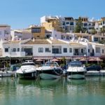 Boats Moored In Cabo Pino Harbour Stock Photo