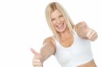 Tilted Image Of Cheerful Lady Showing Thumbs Up Stock Photo