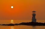 Lighthouse At Sunset Stock Photo