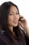 Asian Female Talking On Mobile Stock Photo