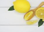 Fresh Lemon Slice On White Wood Background Stock Photo