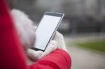 Mobile Phone In Hands With Glowes, Cold Weather Stock Photo