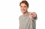 Smiling Young Man Pointing You Out Stock Photo