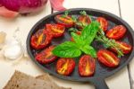 Baked Cherry Tomatoes With Basil And Thyme Stock Photo