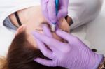 A Woman Getting Permanent Make Up Stock Photo