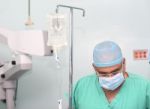 Surgeon Testing The Infusion To A Patient Stock Photo