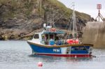 Fishing Boat In Port Isaac Cornwall Stock Photo