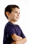 Smiling Boy With Arm Crossed Stock Photo