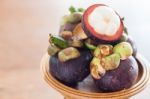 Group Of Mangoesteen On Wooden Tray Stock Photo