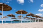 Parasols At Liscia Ruja Beach In Sardinia Stock Photo