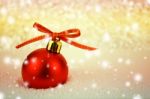 Red Christmas Ball With Bokeh In Merry Metal Tone Stock Photo