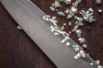 Chopped Onion With Knife On The Wooden Board Top View Stock Photo