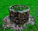 The Ancient Brick Well In Park Stock Photo