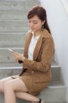 Portrait Of Thai Adult Businesswoman Beautiful Girl Using Her Smart Phone Stock Photo