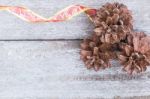 Pine Cones On Wood Background Stock Photo