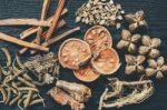 Dried Herbs And Ginseng, Top View Of Thai Herbs And Ginseng On Wooden Floor Stock Photo